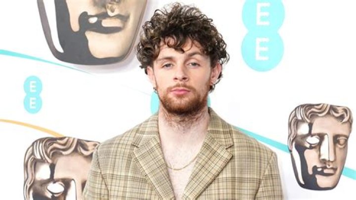 Who is Tom Grennan and what is his net worth?